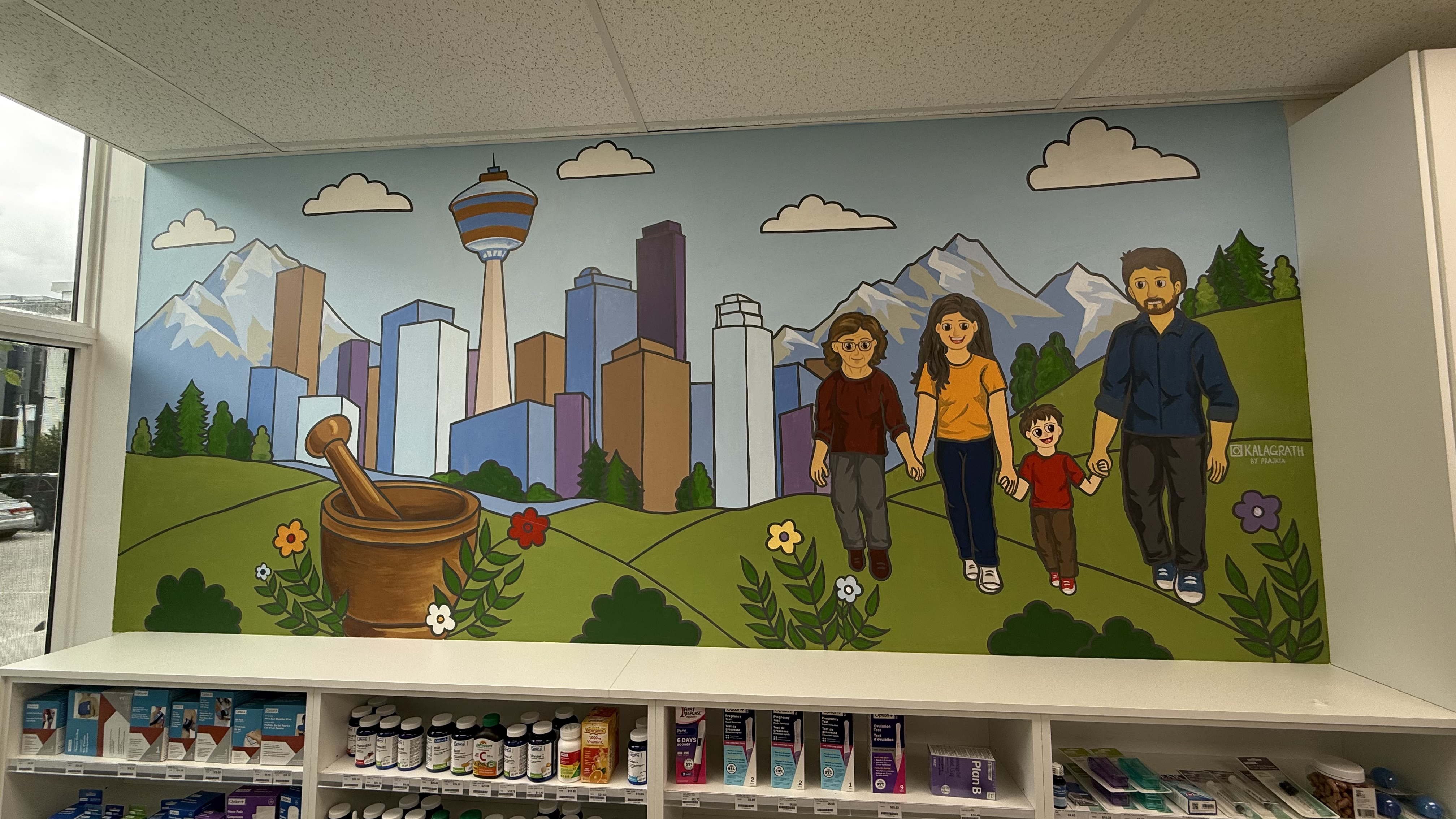 Large pharmacy mural featuring Calgary skyline and a family