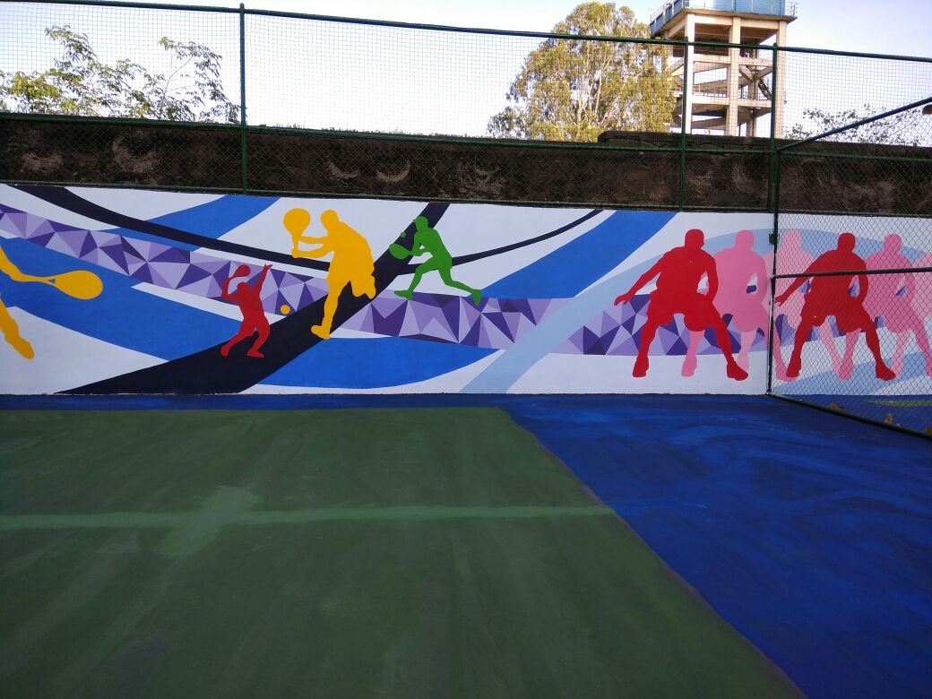 Wide shot of vibrant outdoor sports court mural